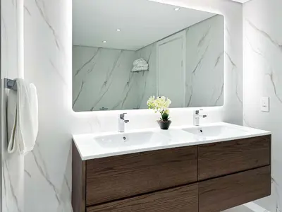 a bathroom with a sink and a mirror at Fabulous 1 bedroom apartment at 5 Star Resort in Dubai