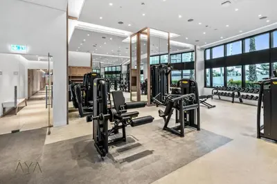 a gym with cardio equipment in a building at Jumeirah Gate Tower 1 - Stylish Apartment with Pool & City Views By ĀYA Boutique in Dubai