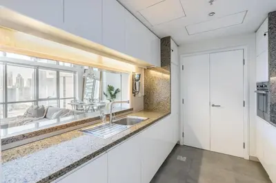 a bathroom with a sink and a window at GuestReady - Upscale Modern Apt in Downtown in Dubai