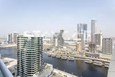 a view of a city with a river and buildings at Staycae Holiday Homes - Vera by DAMAC Near Downtown, Business Bay in Dubai