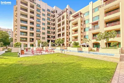 a large apartment building with a lawn in front of it at bnbmehomes - Túria Tower A in Dubai