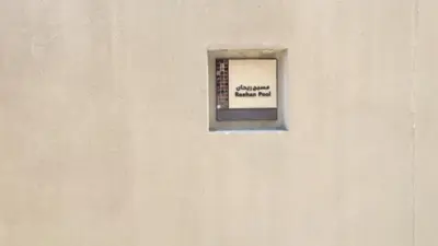 a window in a wall with a sign on it at Burj Dubai Area - 5min Walk - Luxury 2 Bedroom Apartment in Dubai