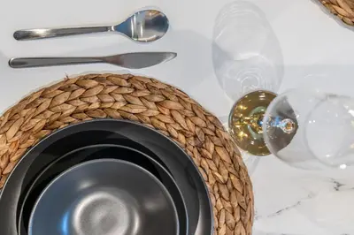 a close up of a metal bowl and utensils at GuestReady - Deluxe Waterfront View in the Marina in Dubai