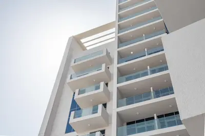 a tall building with balconies on the side of it at Frank Porter - Azizi Aura in Dubai
