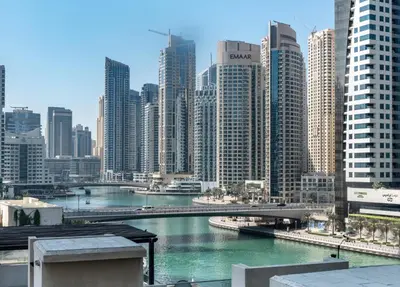 a view of a city with a river and buildings at The Smart Concierge - Marina Scape in Dubai