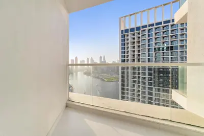a room with a large window with a view of the city at ALiving Luxury Studio with Canal Views I DAMAC Maison Prive 2512 in Dubai