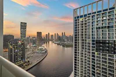 a view of a city with a river and buildings at ALiving Luxury Studio with Canal Views I DAMAC Maison Prive 2512 in Dubai
