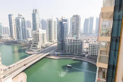 a view of a city with a river and buildings at Enticing space With Marina View Near the Beach! in Dubai