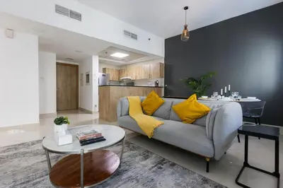 a living room with a couch and a table at Enticing space With Marina View Near the Beach! in Dubai