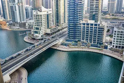 an overhead view of a bridge over a river with buildings at Stunning Space with Full Marina View in Dubai