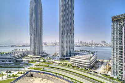 a view of a city with tall buildings and the water at Peaceful 1BR at Creek Rise Tower 2 Dubai Creek Harbour by Deluxe Holiday Homes in Dubai