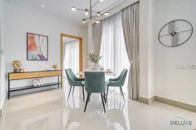 a dining room with a table and chairs at Extravagant 1BR at Opera Grand Downtown Dubai by Deluxe Holiday Homes in Dubai