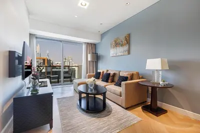 a living room with a couch and a table at Daniels 1BR at JW Marriott with Dubai Marina View in Dubai