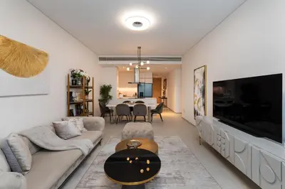 a living room with a large television and a couch at Address JBR Sea Views, Jumeirah Beach Residence, Dubai Marina - Mint Stay in Dubai