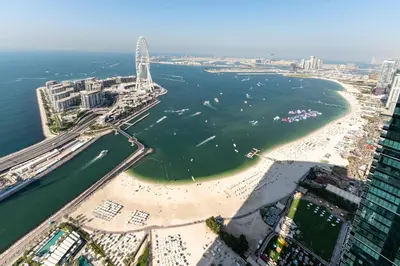 an aerial view of a beach and a bridge at Address JBR Sea Views, Jumeirah Beach Residence, Dubai Marina - Mint Stay in Dubai