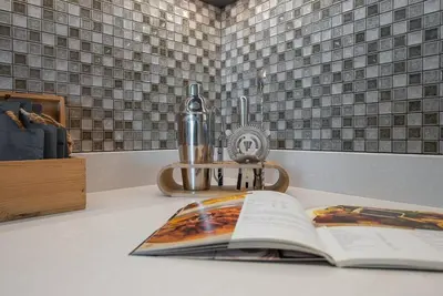 an open book sitting on a counter next to a sink at Luxury apartment 38th floor Dubai MarinaEXPO OFFER in Dubai