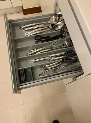 a drawer in a kitchen with silver utensils at Address Dubai Mall Fashion Avenue Studio 17 floor in Dubai