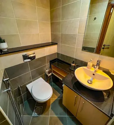 a bathroom with a sink and a toilet at Exquisite, luxe 1BD Apartment, Unparalleled Sea Views, Prime Dubai Marina Location & Full Kitchen by 