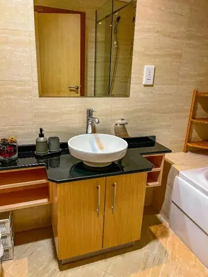 a bathroom with a white sink on a counter at Exquisite, luxe 1BD Apartment, Unparalleled Sea Views, Prime Dubai Marina Location & Full Kitchen by 
