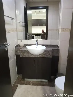 a bathroom with a sink and a mirror at Beach apartment in Dubai in Dubai