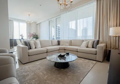 a living room with a couch and a table at Nasma Luxury Stays - Harbour Gate Tower 1 in Dubai