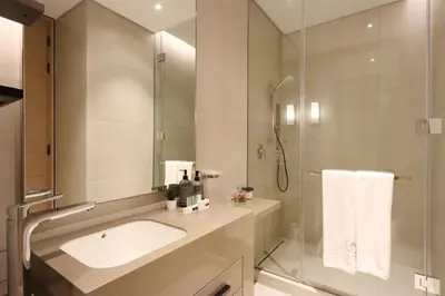 a bathroom with a sink and a shower at Livbnb - Lush 2BR Suite with Sea and Ain View in Address JBR in Dubai