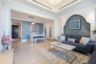 a living room with a couch and a table at 1BDR apartment with Burj Khalifa View I Walking Distance to Dubai Mall I Tajeer in Dubai