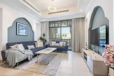 a living room with a couch and a table at 1BDR apartment with Burj Khalifa View I Walking Distance to Dubai Mall I Tajeer in Dubai
