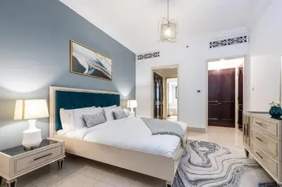 a bedroom with a bed and a dresser and a mirror at 1BDR apartment with Burj Khalifa View I Walking Distance to Dubai Mall I Tajeer in Dubai