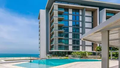 a rendering of a building with a swimming pool and the ocean at Bluewaters Island 2 and 1 BDR Apart with Sea Views in Dubai