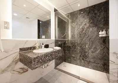 a bathroom with a sink and a mirror at Luxury Beachfront 2Bd Apt, Shams, JBR in Dubai