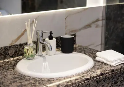 a bathroom sink with a faucet on a counter at Luxury Beachfront 2Bd Apt, Shams, JBR in Dubai