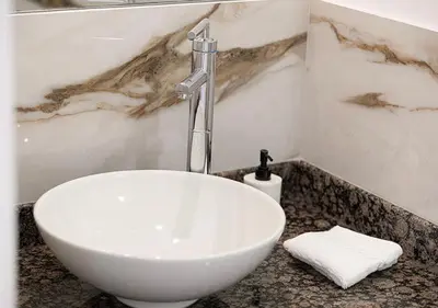 a bathroom sink with a faucet on a counter at Luxury Beachfront 2Bd Apt, Shams, JBR in Dubai