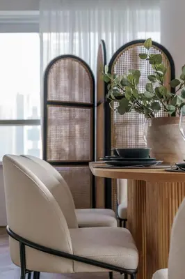 a dining room with two chairs and a table at GuestReady - Bohemian Apt with Marina View in Dubai