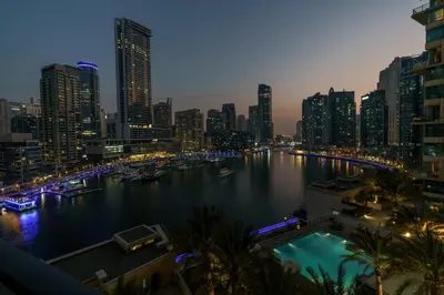 a view of a river in a city at night at GuestReady - Bohemian Apt with Marina View in Dubai