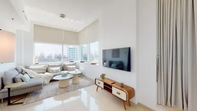 a living room with a couch and a table at BR Luxe 1 BDR Apartment w/ Balcony & Sea Views in Dubai