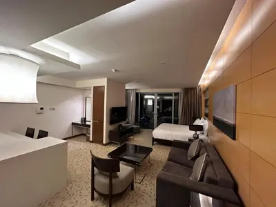 a hotel room with a bed and a living room at Fashion avenue - Formerly Address Dubai Mall Residence in Dubai