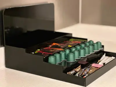 a black box with a bunch of green bullets at Fashion avenue - Formerly Address Dubai Mall Residence in Dubai