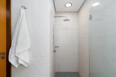 a bathroom with a shower with a glass door at Ultimate Stay 2BR Sea View at JBR Beach Ain Dubai High Floor Luxury Stay in Dubai