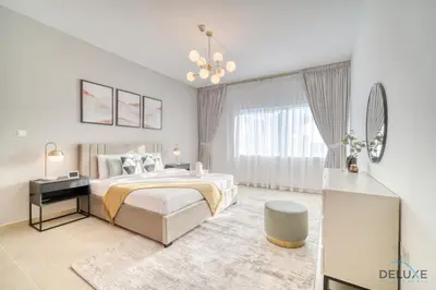 a white bedroom with a bed and a window at Opulent 1BR at MAG 218 Dubai Marina by Deluxe Holiday Homes in Dubai