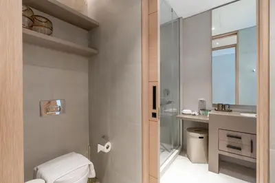 a bathroom with a toilet and a sink at Lux BnB I The Address JBR I Ocean View in Dubai