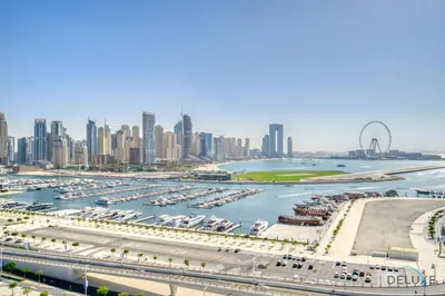 a view of a harbor with a city in the background at Splendid 2BR at Sunrise Bay Tower 1 Emaar Beachfront Dubai Marina by Deluxe Holiday Homes in Dubai