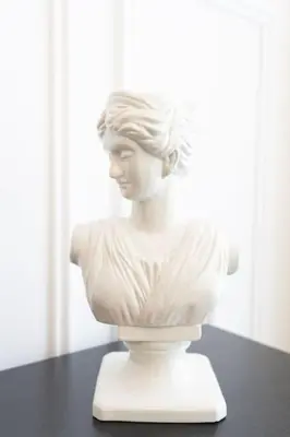 a white bust of a woman sitting on a table at ON OFF HH- CREEK HARBOUR-Lavish Parisian 2 BR in Dubai