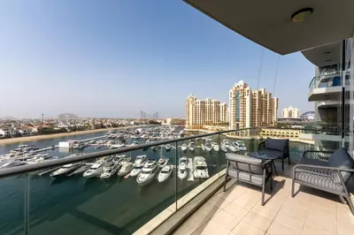 a balcony with a bunch of boats in a marina at Oceana Residences, The Palm Jumeirah - Mint Stay in Dubai