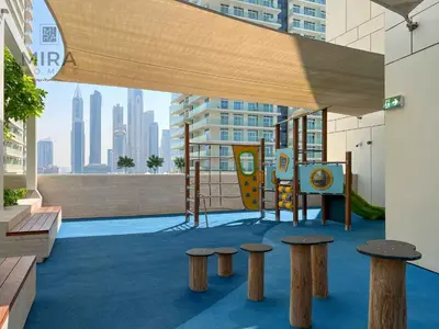 a playground in a building with a view of a city at Mira Holiday Homes - Newly 1 bedroom apartment with beach access in Dubai