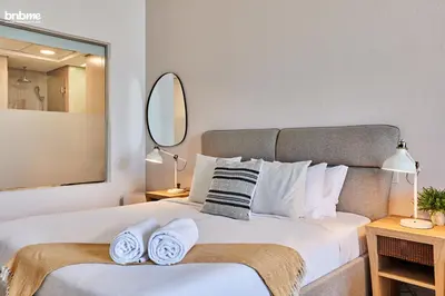 a bedroom with a large bed with towels on it at bnbme - Palm Jumeirah Studio Balcony Sea Ain Dubai Views Pool Gym Parking Access in Dubai