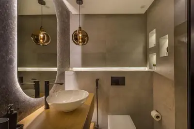 a bathroom with a white sink and a mirror at Horizon Tower - Stunning Four Bedroom in Dubai