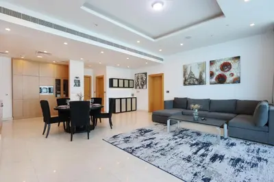 a living room with a couch and a table at Livbnb Suites - 1BR with Sea View & Beach Access in Dubai