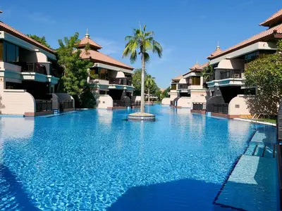 a swimming pool in front of a resort at Lovely 1 bedroom apartment at 5 Star Resort in Dubai