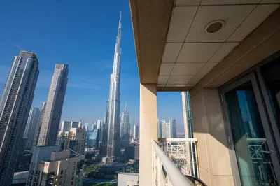 a view of the city from a balcony of a skyscraper at Bellavista - High Floor - 1BR - 29 Boulevard - Full Burj Khalifa & Fountain View in Dubai